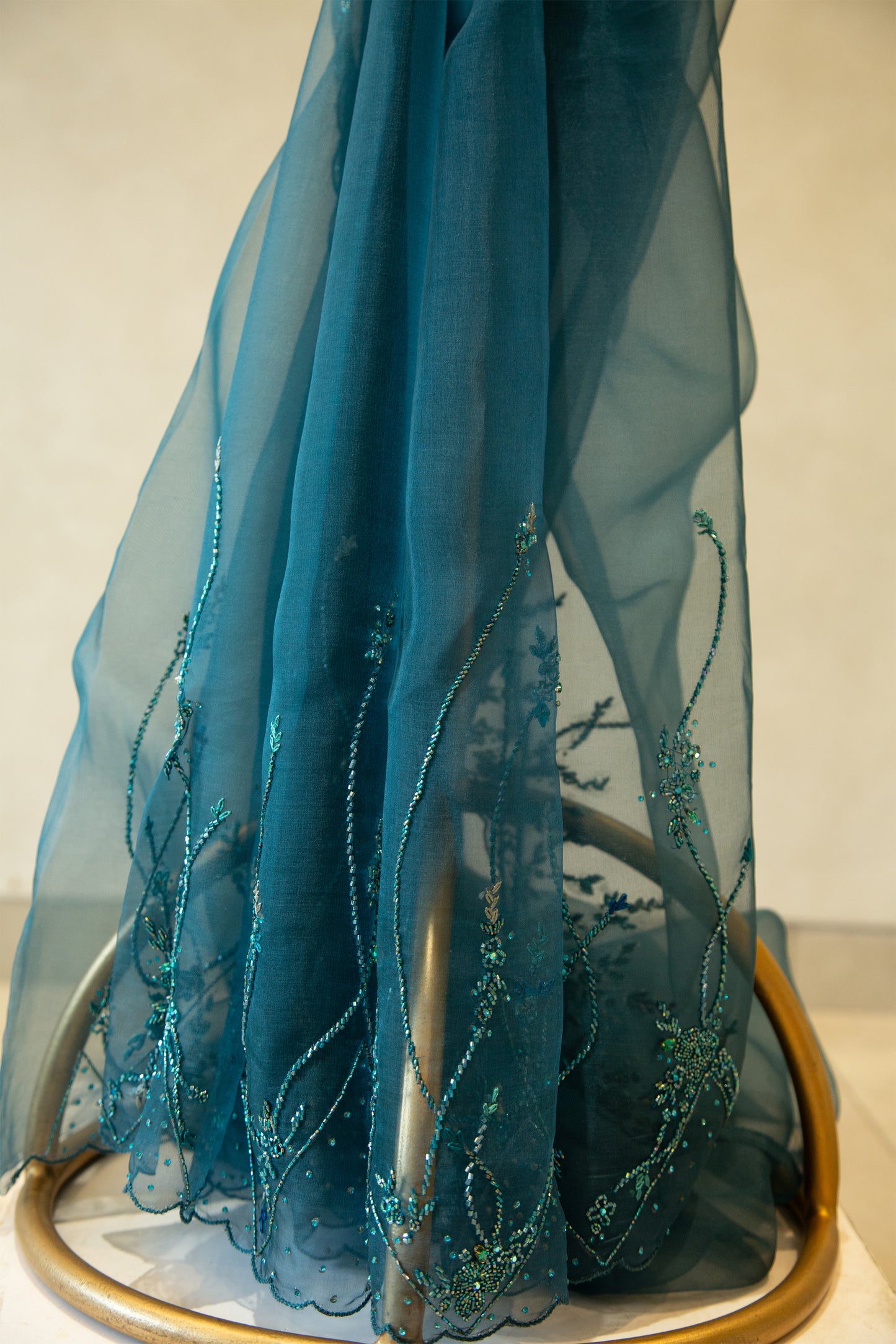 Teal green organza saree